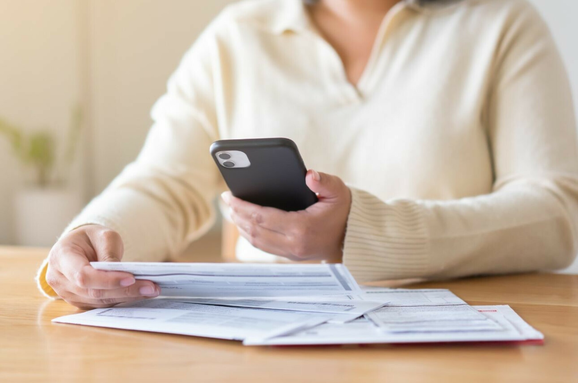 Consumer nz website promo image a woman reviews her power bill