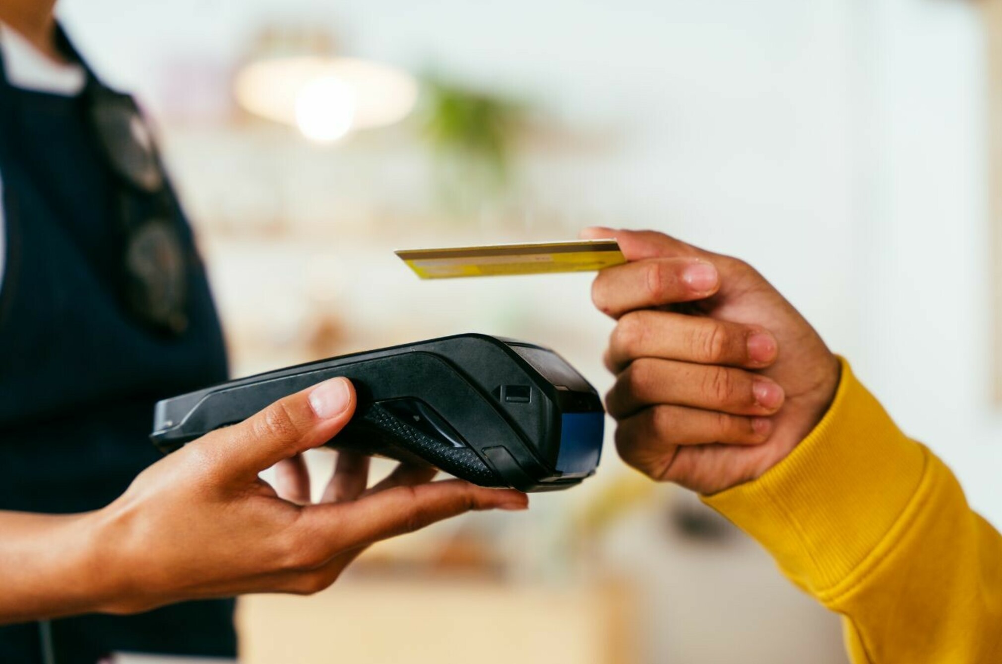Consumer nz website promo image  a customer pays for their brunch on a public holiday