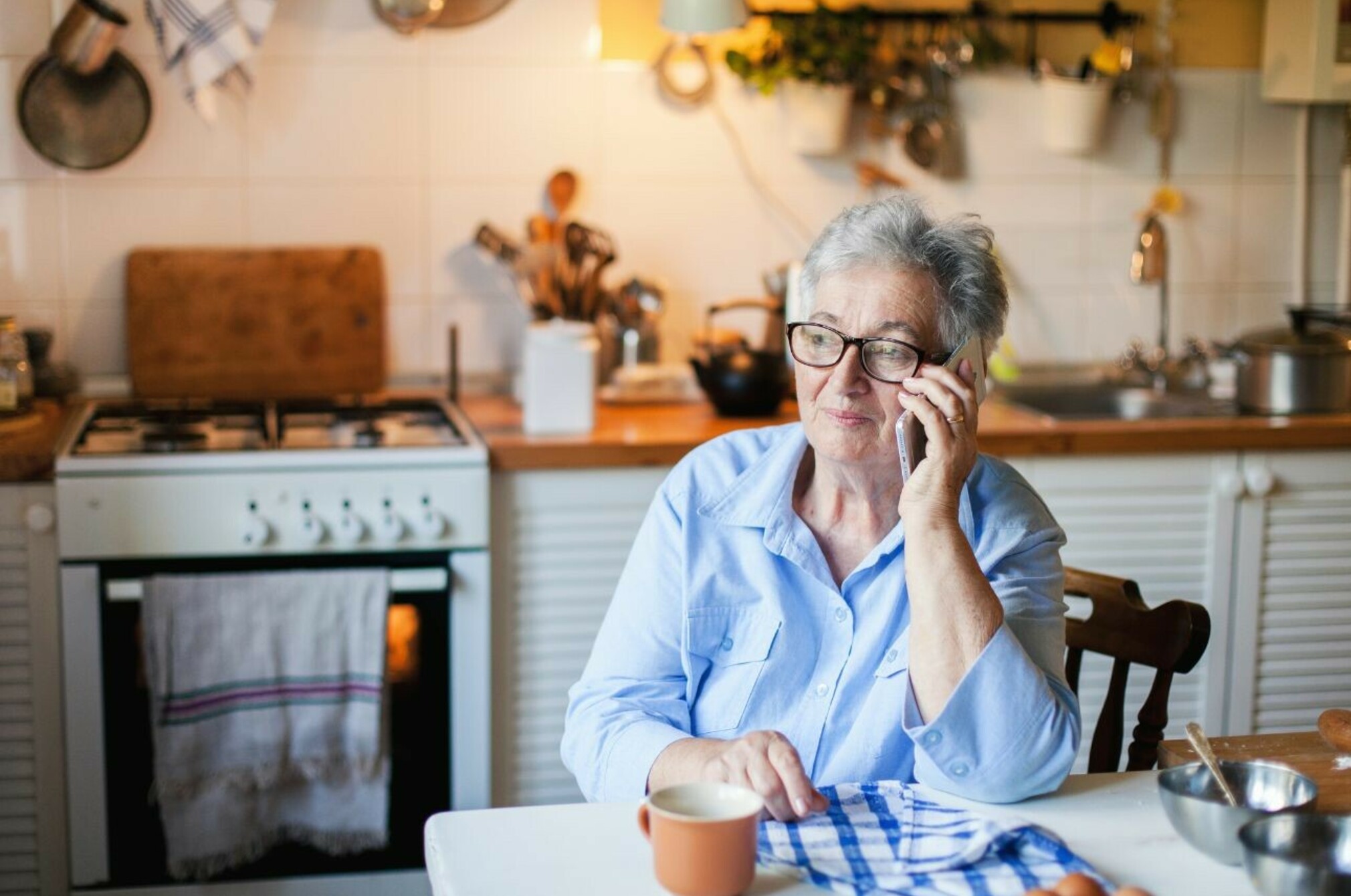Consumer nz website promo image woman calls her power company to ask if she s on their best plan for her needs