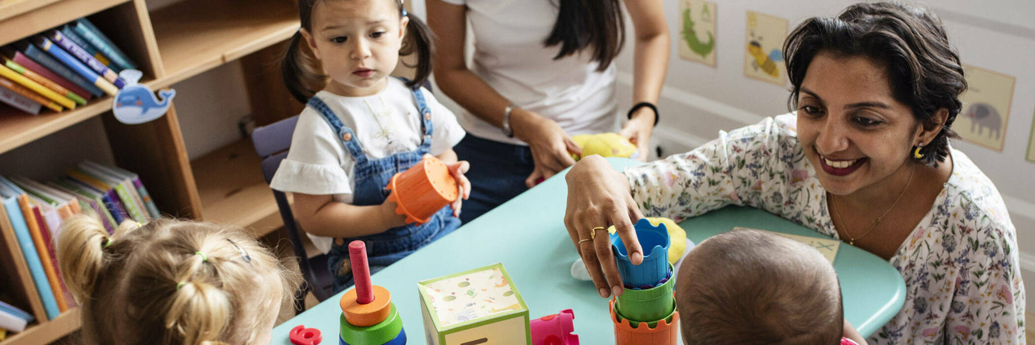 Kindy child talking to teacher