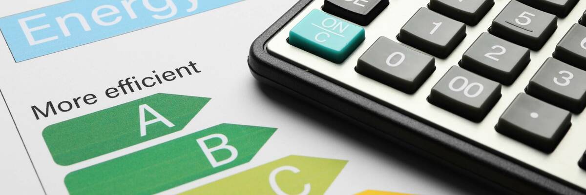 Energy efficiency paper with calculator on top.