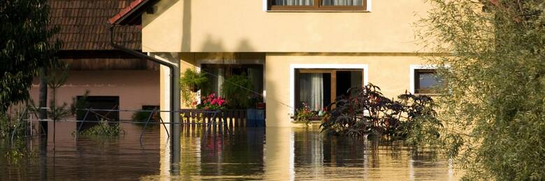 Flood water outside a house.