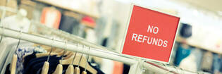 "NO REFUNDS" signage in shop