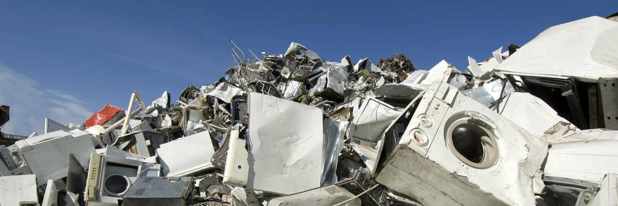 Photograph of a pile of e-waste on landfill.