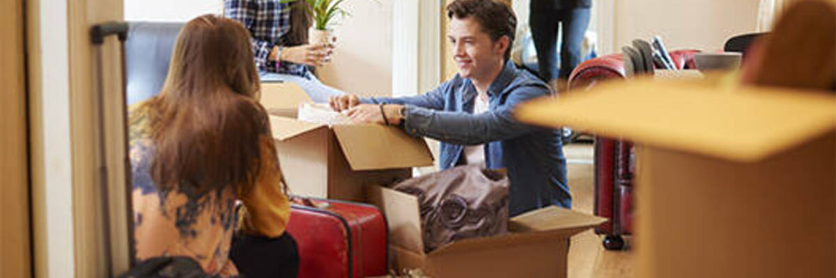 Group of young flatmates moving in.