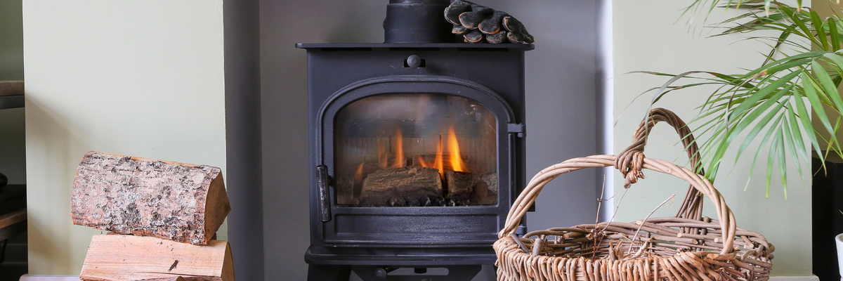 Woodburner lit inside a house.